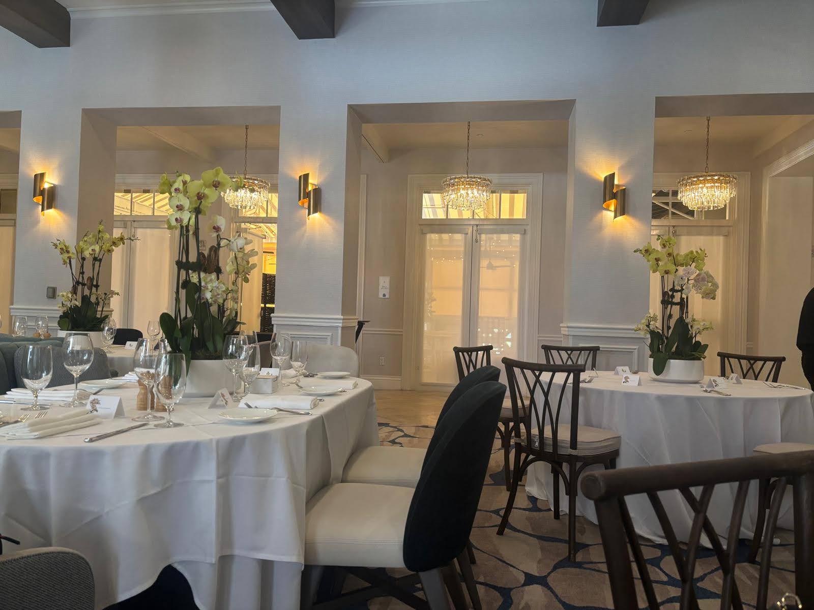 Golden phalaenopsis pair in ceramic pots, private dining room